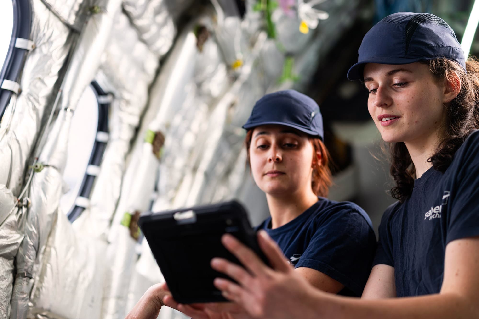 Two Sabena technics technicians performing an interior inspection of an aircraft